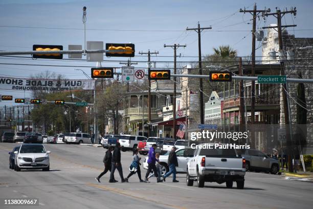Cars drive on Main Street March 16, 2019 in Fredericksburg, Texas