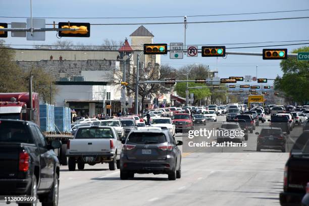 Cars drive on Main Street March 16, 2019 in Fredericksburg, Texas