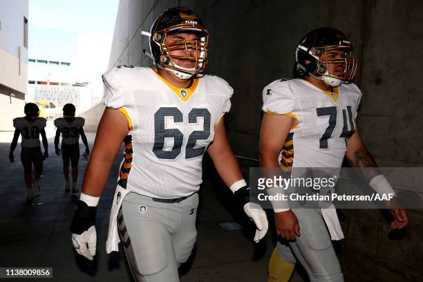 Jeremiah Kolone and Chris Gonzalez of the San Diego Fleet walk in the tunnel prior to the Alliance of American Football game against the San Diego...