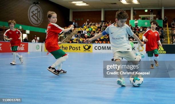 Young children play Futsal during the German Futsal Championship of A, B And C Juniors at Sporthalle West on March 24, 2019 in Gevelsberg, Germany.