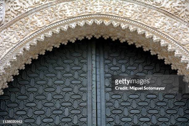 gate of the cathedral of seville - sevilla spain stock-fotos und bilder