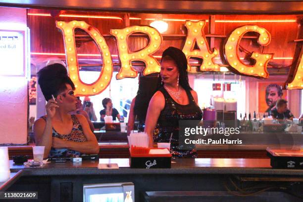 Two Drag Queens talk in the 801 Bourbon Bar a Nightclub with a gay bar & lively mix of drag shows.The tourist scene is very mixed and liberal on...