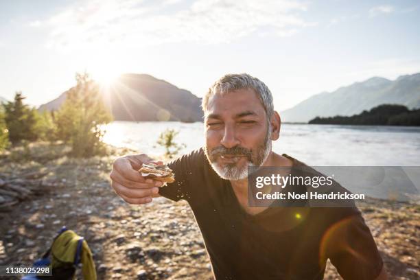 eating a messy smore - eating indulgence stock pictures, royalty-free photos & images