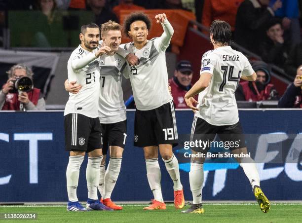 Nico Schulz of Germany celebrates with team mates after scoring his team's third goal during the 2020 UEFA European Championships group C qualifying...