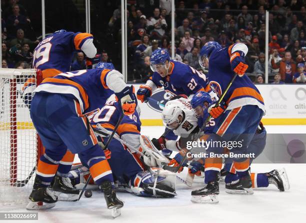 Robin Lehner and the New York Islanders stop a short-handed attempt by Brad Richardson of the Arizona Coyotes during the third period at NYCB Live's...