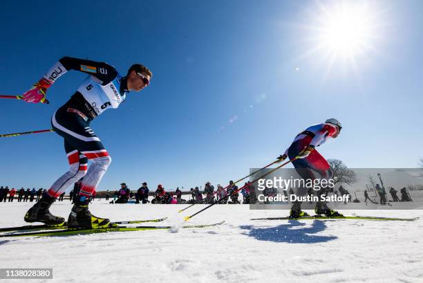Didrik Toenseth of Norway and Sindre Bjoernestad Skar of Norway competes in the Men's 15km freestyle pursuit during the FIS Cross Country Ski World...