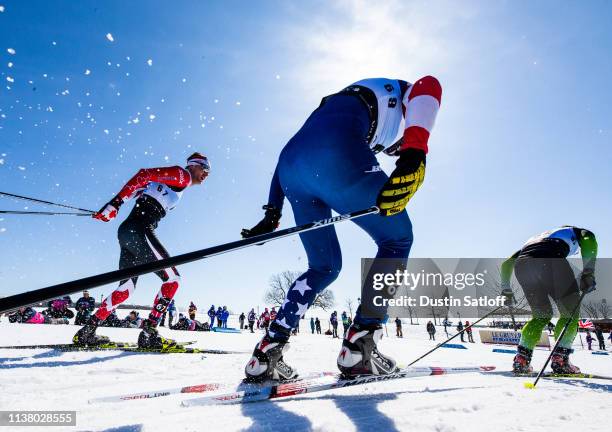 Bob Thompson of Canada and Ben Ogden of the United States competes in the Men's 15km freestyle pursuit during the FIS Cross Country Ski World Cup...