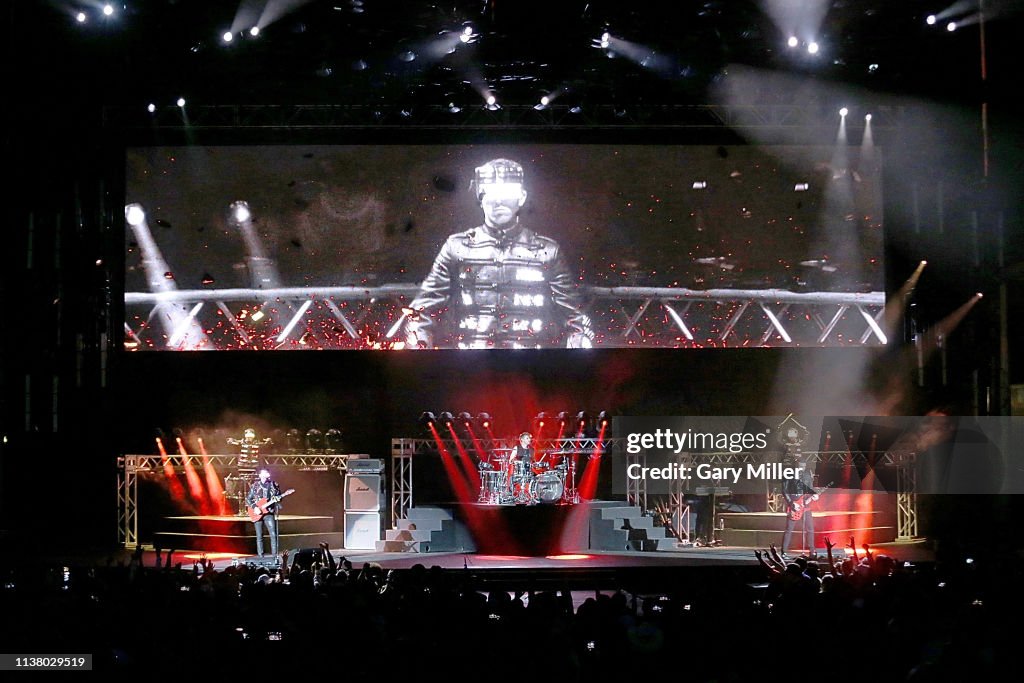 Austin Muse Matt Bellamy, Dominic Howard and Chris Wolstenholme of Muse perform ...