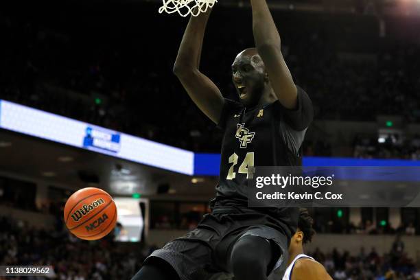 Tacko Fall of the UCF Knights dunks the ball against the Duke Blue Devils during the first half in the second round game of the 2019 NCAA Men's...