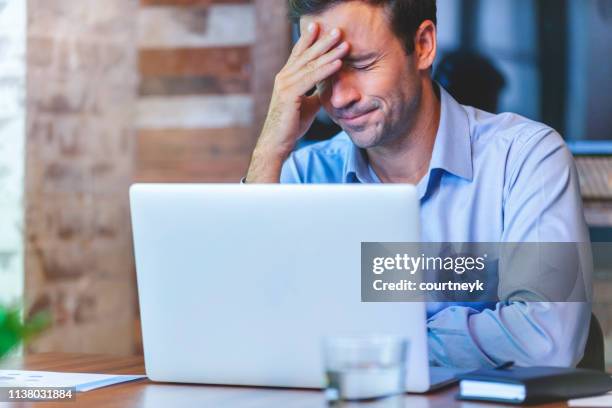 stressed business man at the office. - work mistake stock pictures, royalty-free photos & images