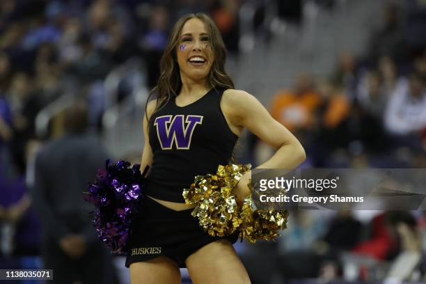 Washington Huskies cheerleader performs during their game against the North Carolina Tar Heels in the Second Round of the NCAA Basketball Tournament...