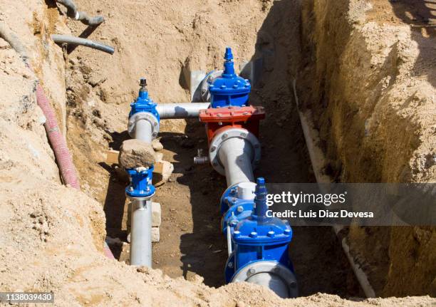 street humanizing, changing cement pipes for plastic pipes - sewage pipe stock pictures, royalty-free photos & images