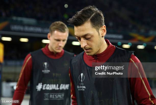 Bernd Leno and Mesut Ozil of Arsenal during the UEFA Europa League quarter-finals second leg football match SSC Napoli v Arsenal Fc at the San Paolo...