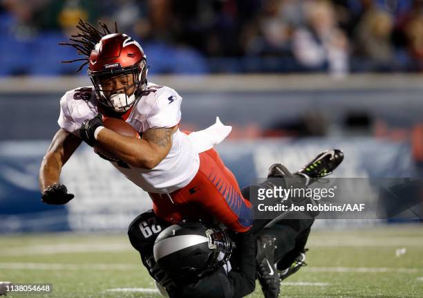 Terrence Magee of the Memphis Express is tackled by Bradley Sylve of the Birmingham Iron during the first half of their Alliance of American Football...