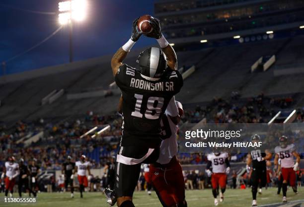 Jamal Robinson Jr of the Birmingham Iron makes a catch against Jeremy Cutrer of the Memphis Express during the first quarter of their Alliance of...