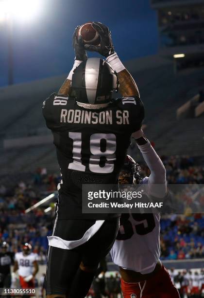 Jamal Robinson Jr of the Birmingham Iron makes a catch against Jeremy Cutrer of the Memphis Express during the first quarter of their Alliance of...