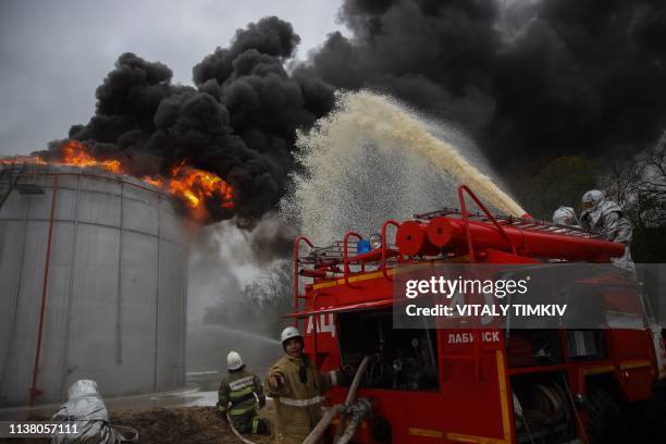 Firefighters take part in an exercise simulating a fire breaking out on an oil storage tank, Krasnodar region, April 19, 2019.