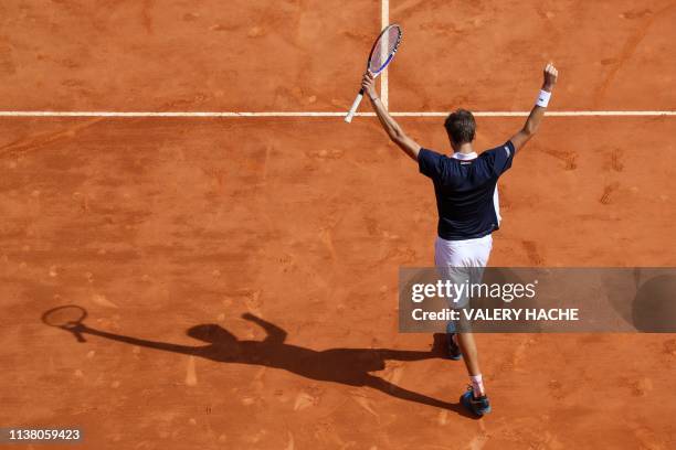 Russia's Daniil Medvedev celebrates after his victory against Serbia's Novak Djokovic in the quarter final tennis match on the day 7 of the...