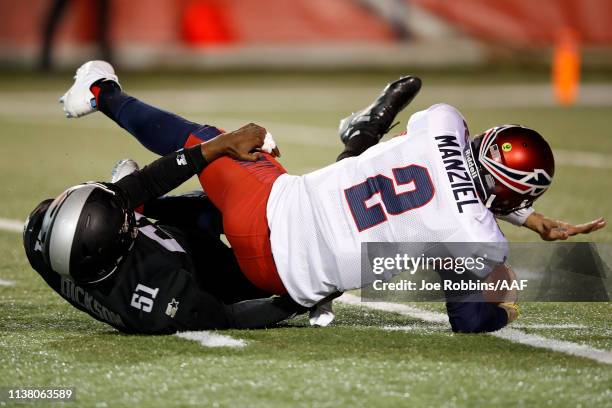 Quarterback Johnny Manziel of the Memphis Express is sacked by Xzavier Dickson of the Birmingham Iron during the third quarter of their Alliance of...