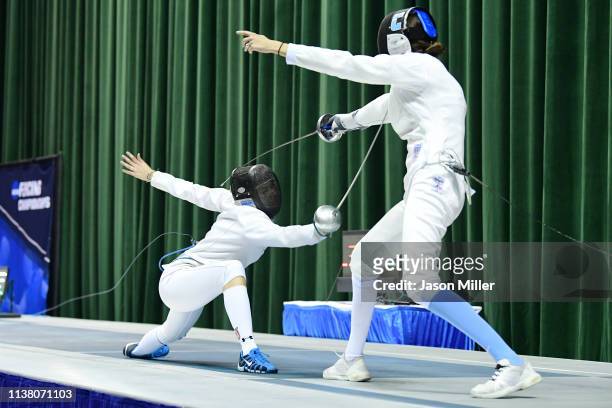 Andrea Vittoria Rizzi of St. John's competes against Anne Cebula of Columbia during the Division I Women's Fencing Championship held at The Wolstein...