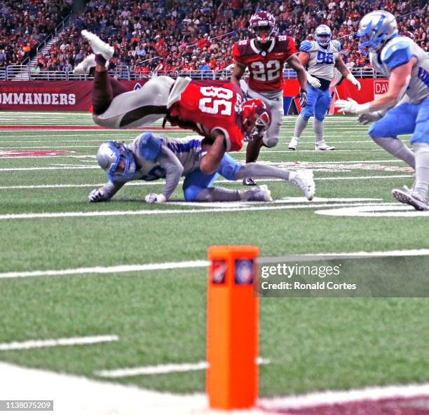 Cam Clear of the San Antonio Commanders is upended by the Salt Lake Stallions at Alamodome on March 23, 2019 in San Antonio, Texas.