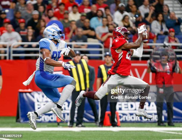 Duke Thomas of San Antonio Commanders intercepts a pass in front of Nick Truesdell of Salt Lake Stallions during the second quarter of the Alliance...