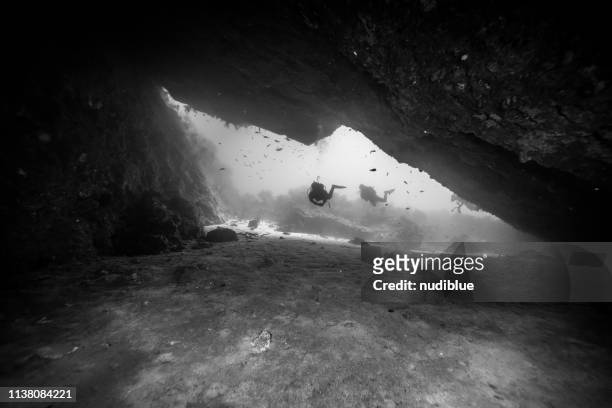 diver between cracks - malta diving stock pictures, royalty-free photos & images