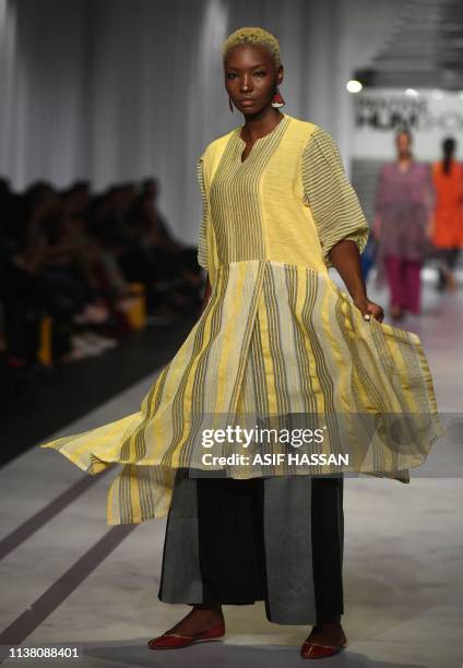 Model presents a creation by Pakistani fashion brand Umer and Imrana on the second day of the 'Hum Showcase' Fashion Week in Karachi on April 19,...