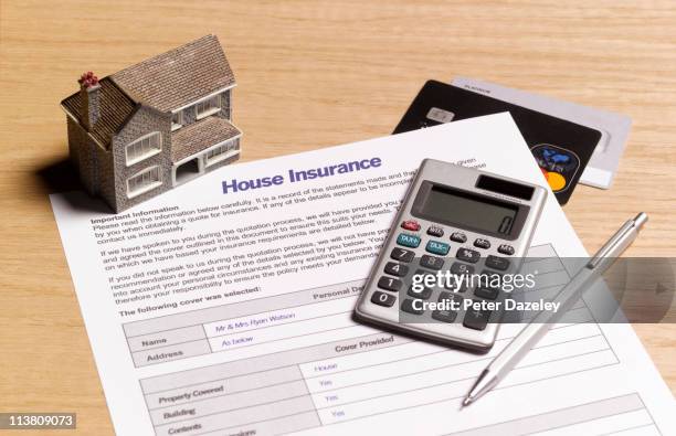 house insurance paperwork - wohngebäudeversicherung stock-fotos und bilder