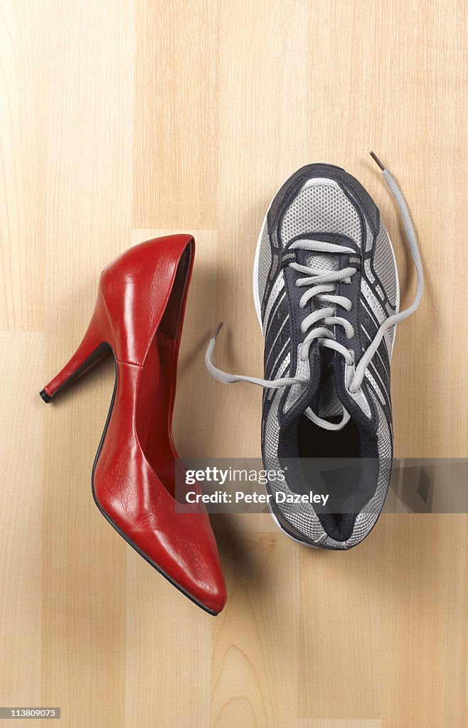 Woman's high heel red shoe and trainer