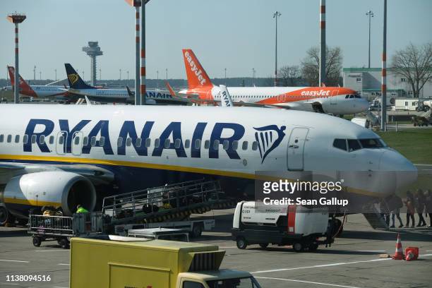 Ryanair and easyJet passenger planes stand at Schoenefeld Airport near Berlin on March 20, 2019 in Schoenefeld, Germany. Schoenefeld has become a hub...