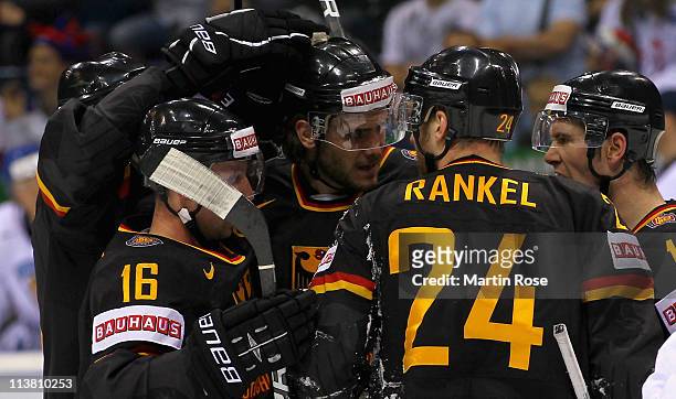 Andre Rankel of Germany celebrate with his team mates after he scores his team's equalizing goal during the IIHF World Championship qualification...