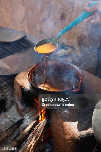 woman preparing "mole" sauce - mole sauce fotografías e imágenes de stock