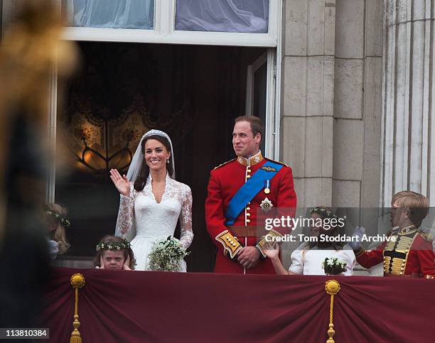 Their Royal Highnesses Prince William, Duke of Cambridge and Catherine, Duchess of Cambridge stand on the balcony at Buckingham Palace after their...