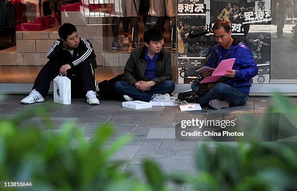 Man unpacks a new iPad 2 at the Sanlitun Apple Store on May 6, 2011 in Beijing, China. Apple Inc. Launched its iPad2 tablet computers in the Chinese...