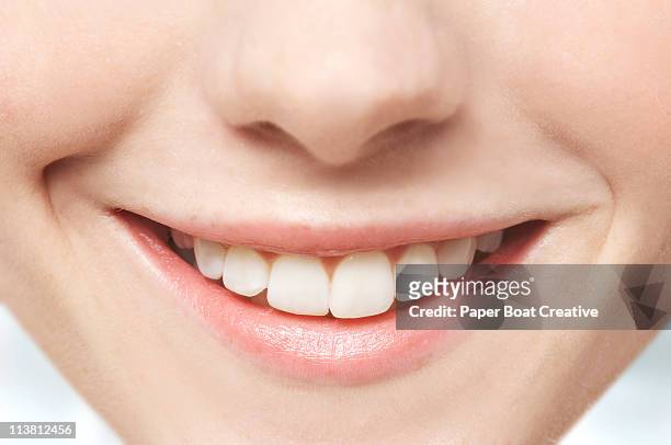 close up of mouth and white teeth - toothy smile stock pictures, royalty-free photos & images