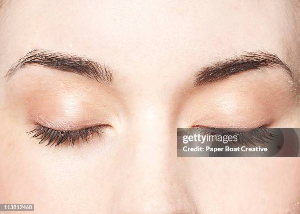 young lady with her eyes closed, close up - occhi chiusi foto e immagini stock