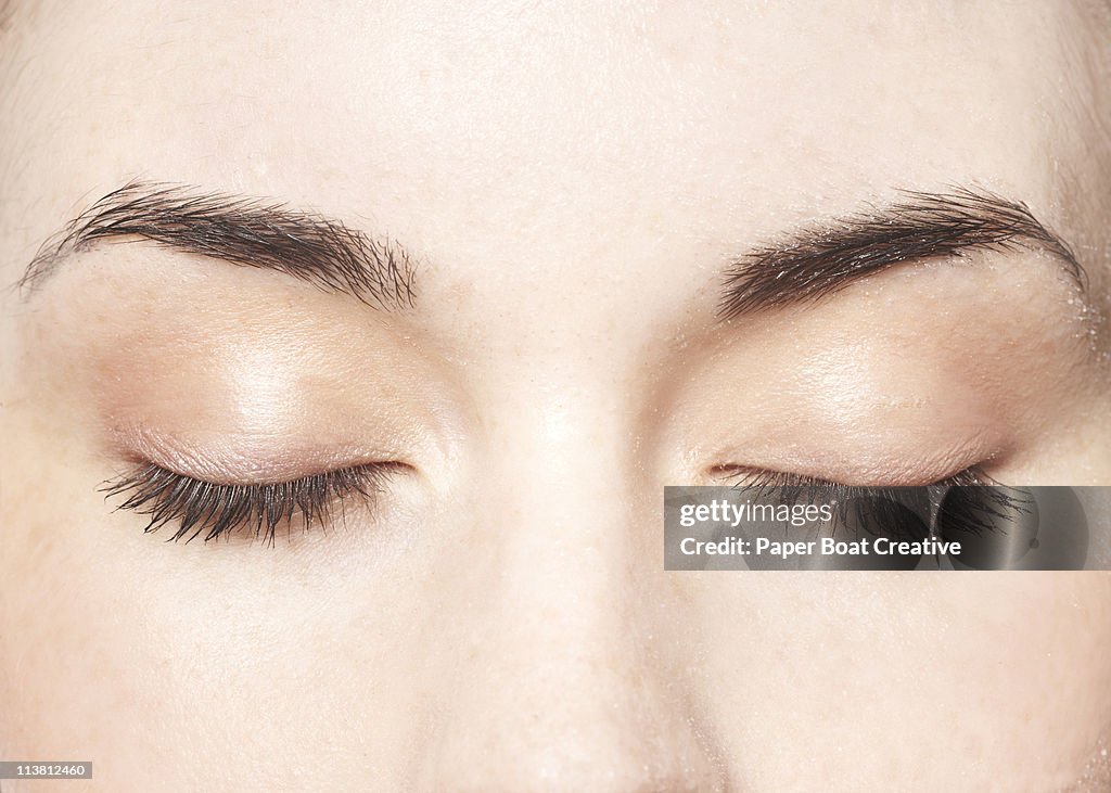 Young lady with her eyes closed, close up