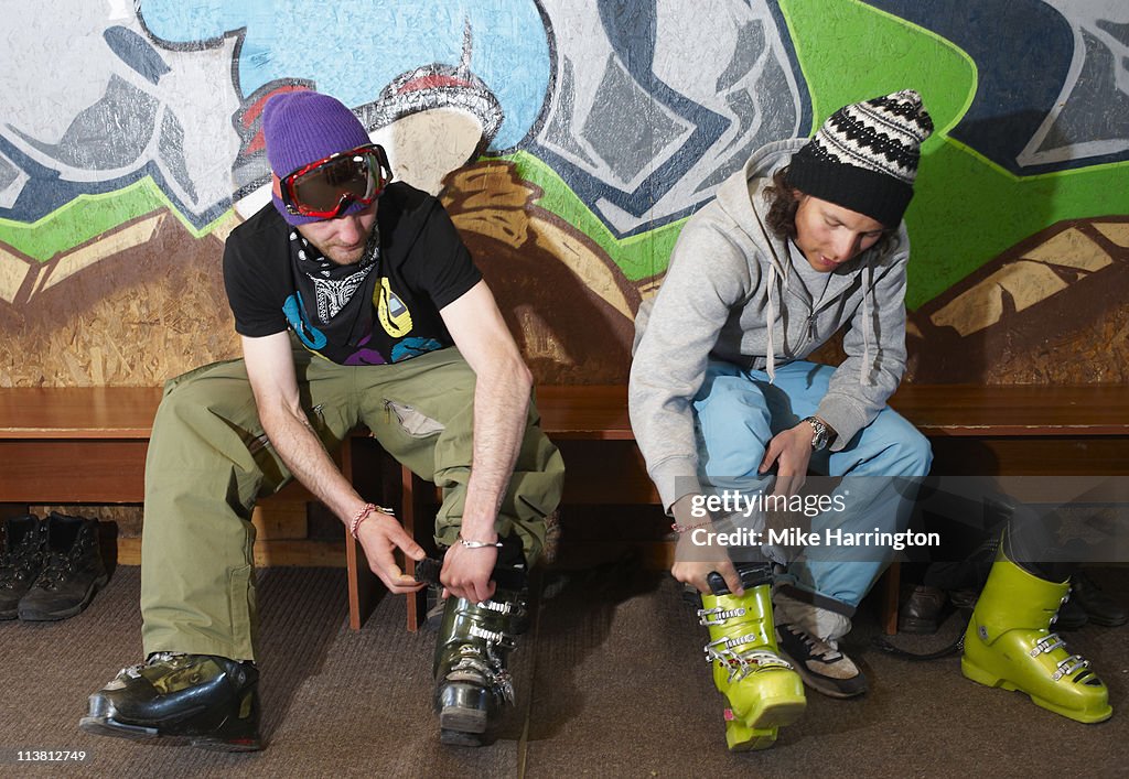 Two Male Skiers In Boot Room, Bansko