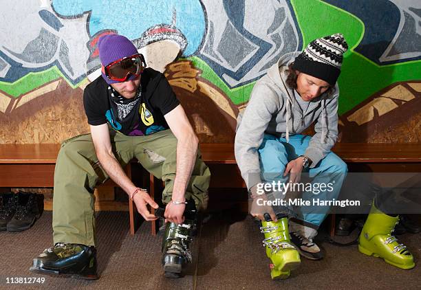 two male skiers in boot room, bansko - skischoen stockfoto's en -beelden