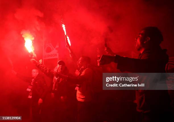 Fans light flares and smoke bombs after the UEFA Women's Champions League: Quarter Final First Leg match between Chelsea Women and Paris...