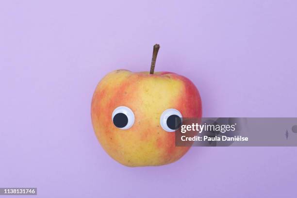 googly eyed apple - google eyes stock pictures, royalty-free photos & images