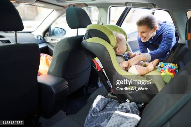 we have some cute and precious cargo onboard this trip - baby car seat stock pictures, royalty-free photos & images
