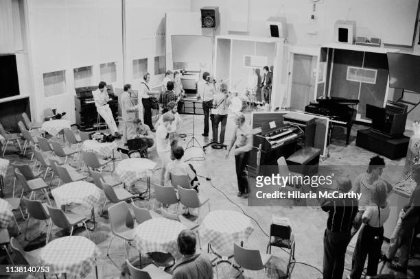 People attend the multimedia presentation of 'The Beatles at Abbey Road' hosted by Abbey Road Studios focusing on the Beatles's recording career,...