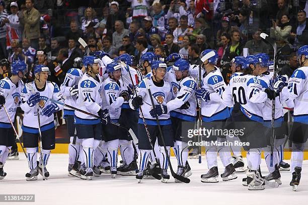 The team of Finland celebrate after the IIHF World Championship qualification match between Germany and Finland at Orange Arena on May 6, 2011 in...