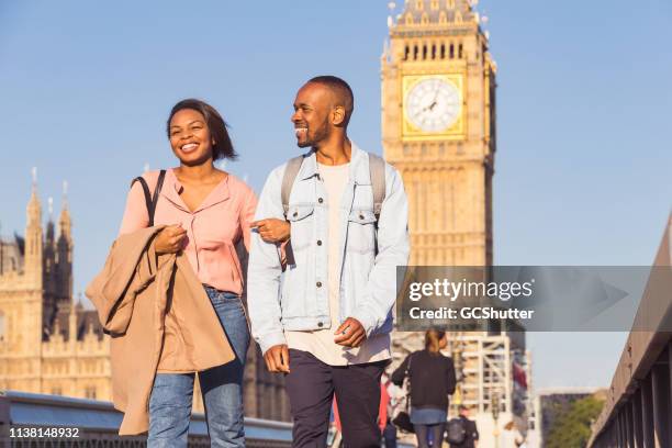 couple visiting england for their vacation - westminster bridge stock pictures, royalty-free photos & images