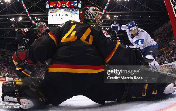 Dennis Endras , goaltender of Germany saves the puck during the IIHF World Championship qualification match between Germany and Finland at Orange...
