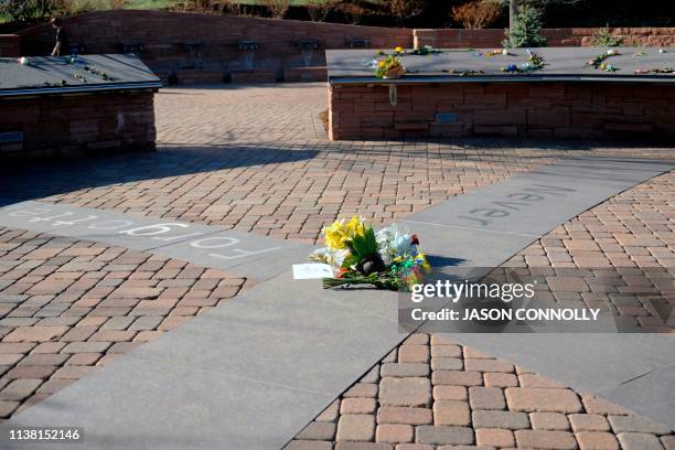 Students from Columbine High visit the Columbine Memorial at Clement Park in Littleton, Colorado, before a community vigil for the 20th anniversary...