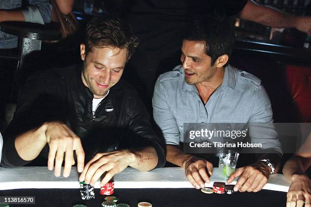 Shaun Sipos and Nicholas Gonzales play poker at the Velvet Margarita and Friends Of El Faro Annual Celebrity Poker Tournament at Velvet Margarita on...