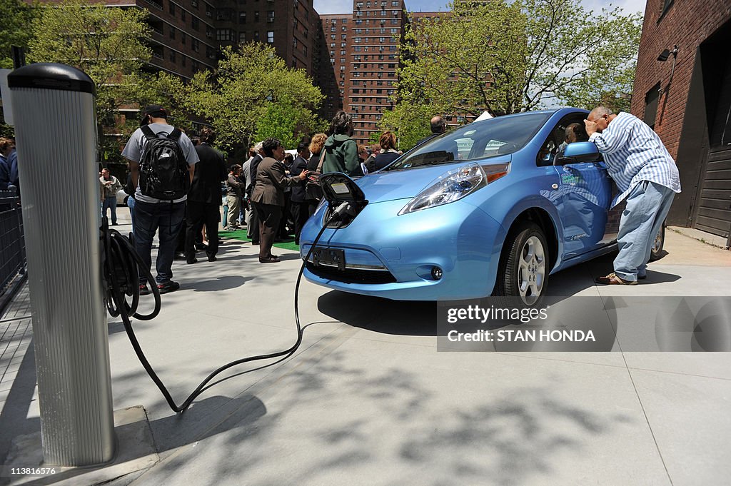A man looks into a Nissan Leaf electric